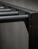 Flat-Black freestanding surf board storage rack showing the high-quality foam covered dowels, and foam spacers to help protect watercraft. The picture shows the top of the rack.