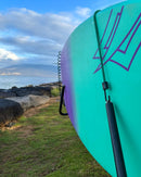 Close up of the E-bike surfboard & SUP Bike Rack Bungie loops being used to secure a board in the rack.
