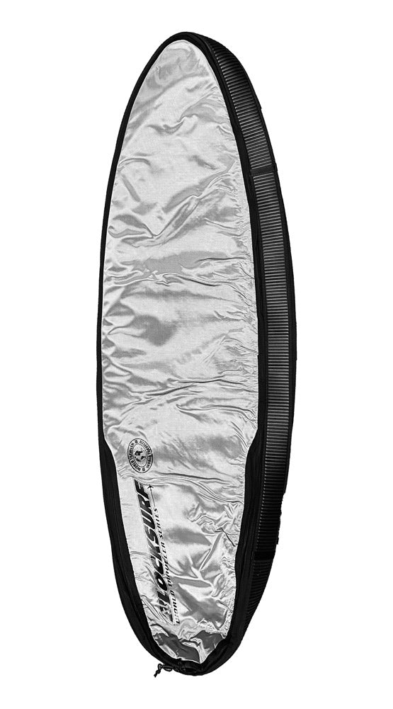 A heavy duty compact surfboard travel bag resting on its side, displaying the silver UV reflective underside.