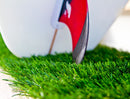 Closeup Shot of the Grassy Base for protecting the Surfboards tails on the Epic Surf Racks Vertical Freestanding board rack. The grass is made of a faux grass turf in a vibrant green. There is a surfboard tail sitting on the grass and the board has a carbon and red fin installed.