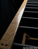 Top-View of the Wooden freestanding surf board rack shown with the High-Gloss Outdoor sealant finish on the wood. High-Gloss Outdoor Sealant is in white text.