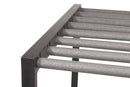 Top portion of the BlackOut Grassy Surf Rack shown in a flat black color. the rack is sitting over a white background. The rack has several foam covered dowels coming off the wood.