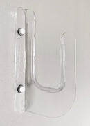 Close up image of the acrylic flush mount surfboard rack. The surf rack is mounted to a grey wall, using two bolts, that have white caps. The rack is entirely clear.