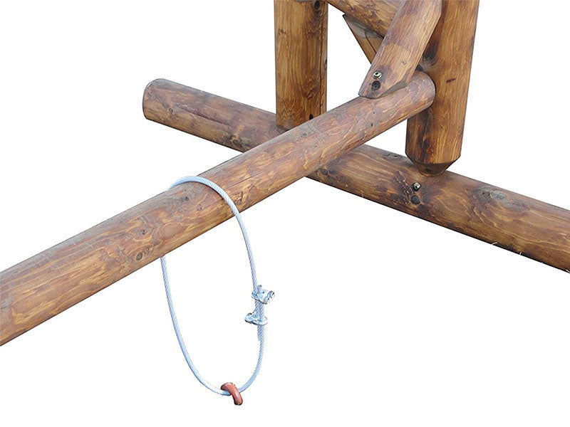 Close up of the log freestanding kayak & canoe  rack being used on a white background.  The rack is made of log and the anchors are made of metal keeping it secure in the ground. 