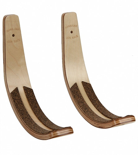 Blonde Wooden Wall Rack that holds surfboards, skis, wakeboards, and snowboards.  The wood is a light brown color.  Has cork padding for the watercrafts protection.  The image is on a white background. 