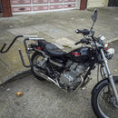 Surfboard Moped Rack | Dual-Mount -Mounted on a motorcycle, and parked next to a curb.
