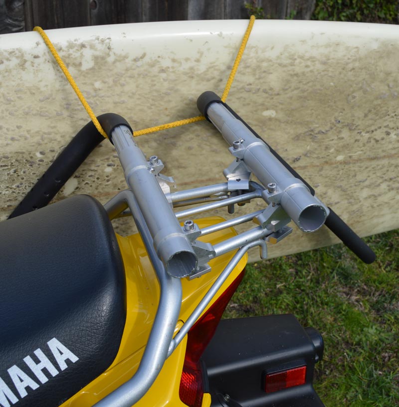 Close up image of how the SUP surf rack mounts to a luggage rack, using it's C-Clamp mounting system.