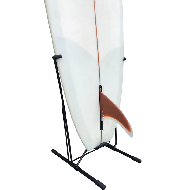 Steel Single Freestanding surf rack made of black metal showing the lower half of a s white surfboard with a single maroon fin. There is a white background over the entire image. 