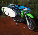 Single Mount Motorcycle & Moped Surfboard rack shown mounted to a Kawasaki dirt bike. The bike actually has two surfboard racks mounted, one on each side, with a surfboard in each rack.
