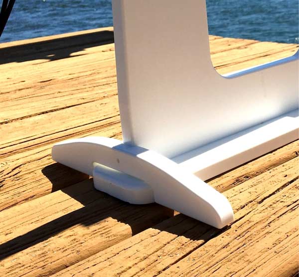 White Side Support Arms for SUP Dock Rack.  The support arms are attached to the sup dock rack and the rack is on a dock next to a lake. 