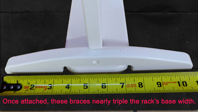 Image showing the support brace's measurement for theSUP & Surfboard Rack for Docks and Piers. the measurement shows that it's roughly 11 inches wide. Text at the bottom of the image reads "Once attached, these braces nearly triple the rack's base width."