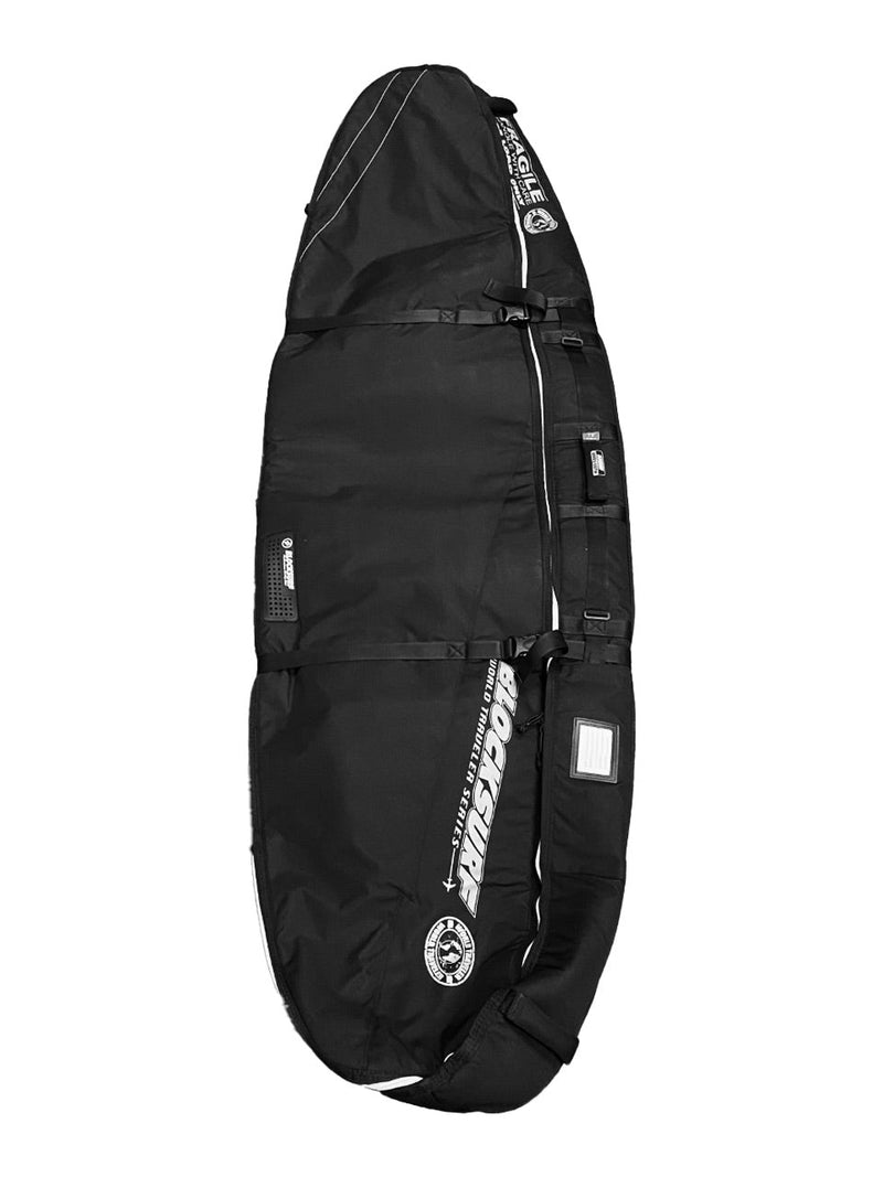 Thick and heavy duty compact surfboard travel bag laying on facing up showing the side straps that keep the surfboards stable.