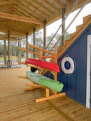 Log Kayak and canoe rack shown on a high end dock.  The dock has a wooden covering with exposes (open) walls.  The log kayak rack is holding two kayaks. 