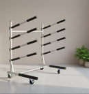 Freestanding SUP and Kayak rack made of metal shown in a grey room with locking casters. 