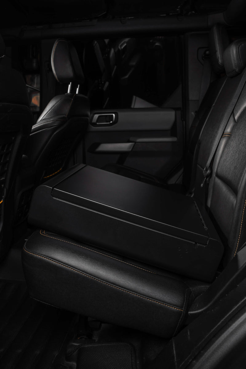 Side view of the Boostedsafe elite shown in stalled in the back of a luxury vehicle with the main door shown in the locked position. 
