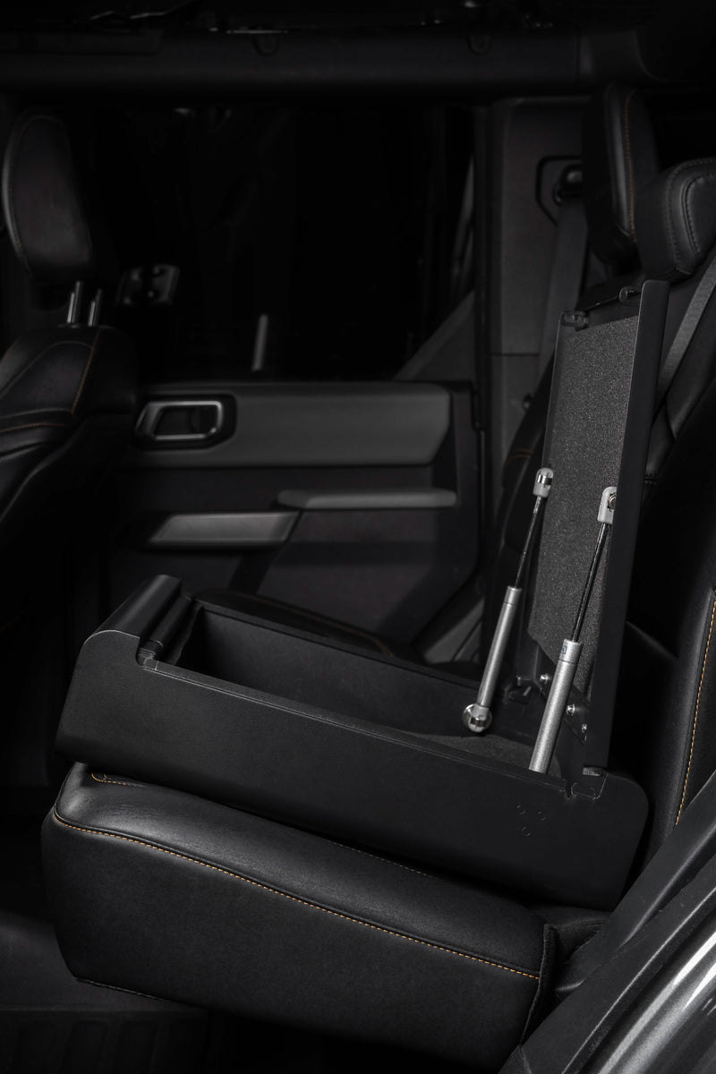 Side view of the Boostedsafe installed installed in the back seat of a luxury vehicle.  The vehicle safe is shown in the open position. 