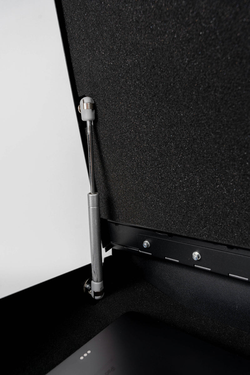 Interior view of the portable vehicle safe's gas struts that keep the main door open when in use. The vehicle safe comes with two of two of these.