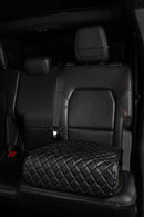 Boostedsafe elite shown in stalled in the back of a vehicle with the cover installed, the safe is in the locked position to the vehicle, and the main door is locked.