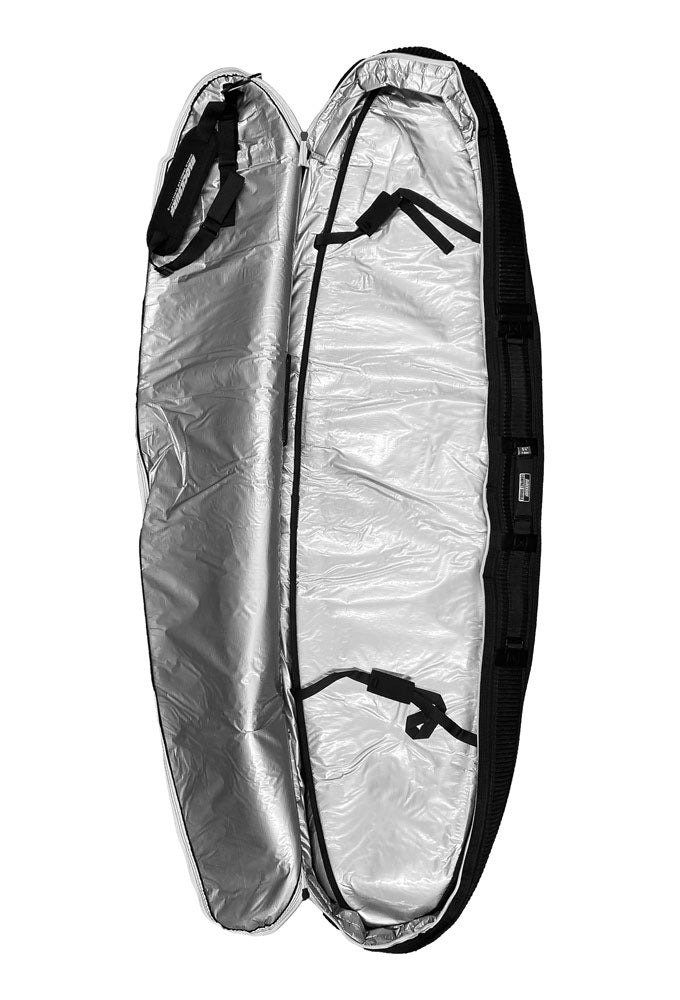 A heavy duty compact surfboard travel bag laying top side on the floorA close up image of a half unzipped black surfboard travel bag that has a zipper system that is heavy duty in appearance, yet smooth to operate.