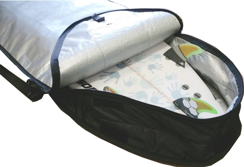 Close up image of the closure system on the Single Day Use Bag.  The bag shows it's expandable ability to make room for surfboard fins.