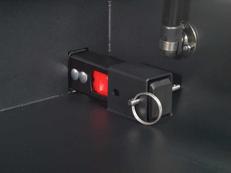 Closeup view of the portable vehicle safe's ISofix connection points and their removable quick-release pints. 