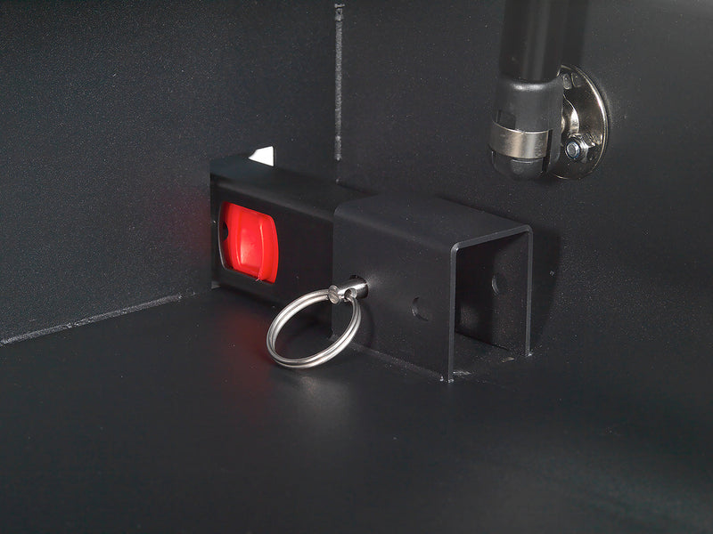 Closeup view of the Boostedsafe's Isofix connection points look from inside the safe.  The red buttons are shown with quick release pins, showing how the safe can be easily be removed from any vehicle in seconds. 