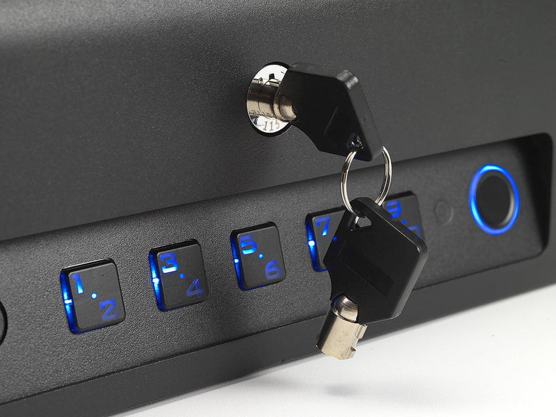 Closeup view of the vehicle safe's keyed entry system being used. 