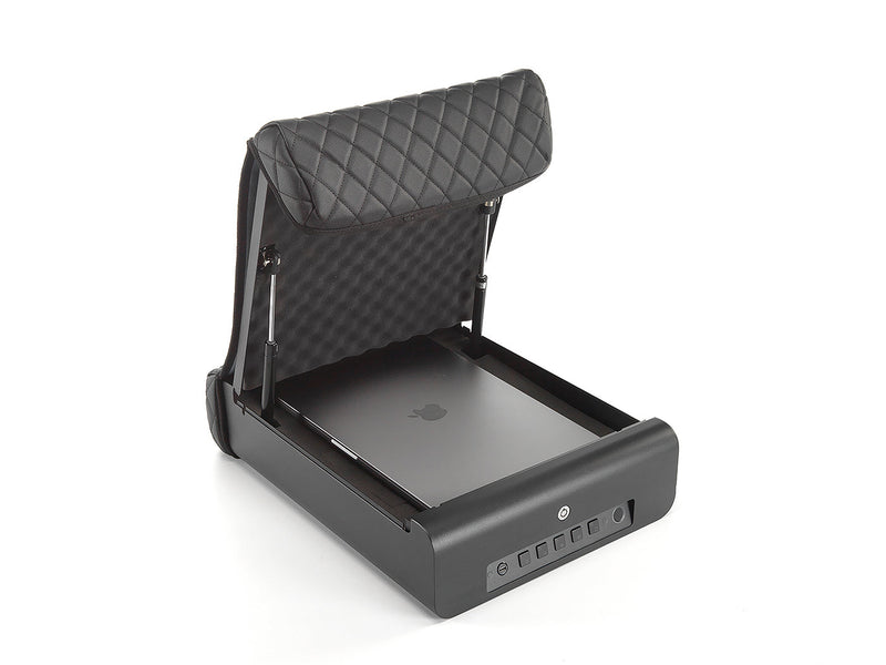 Full size macbook pro laptop shown being stored in the Boosted safe portable safe