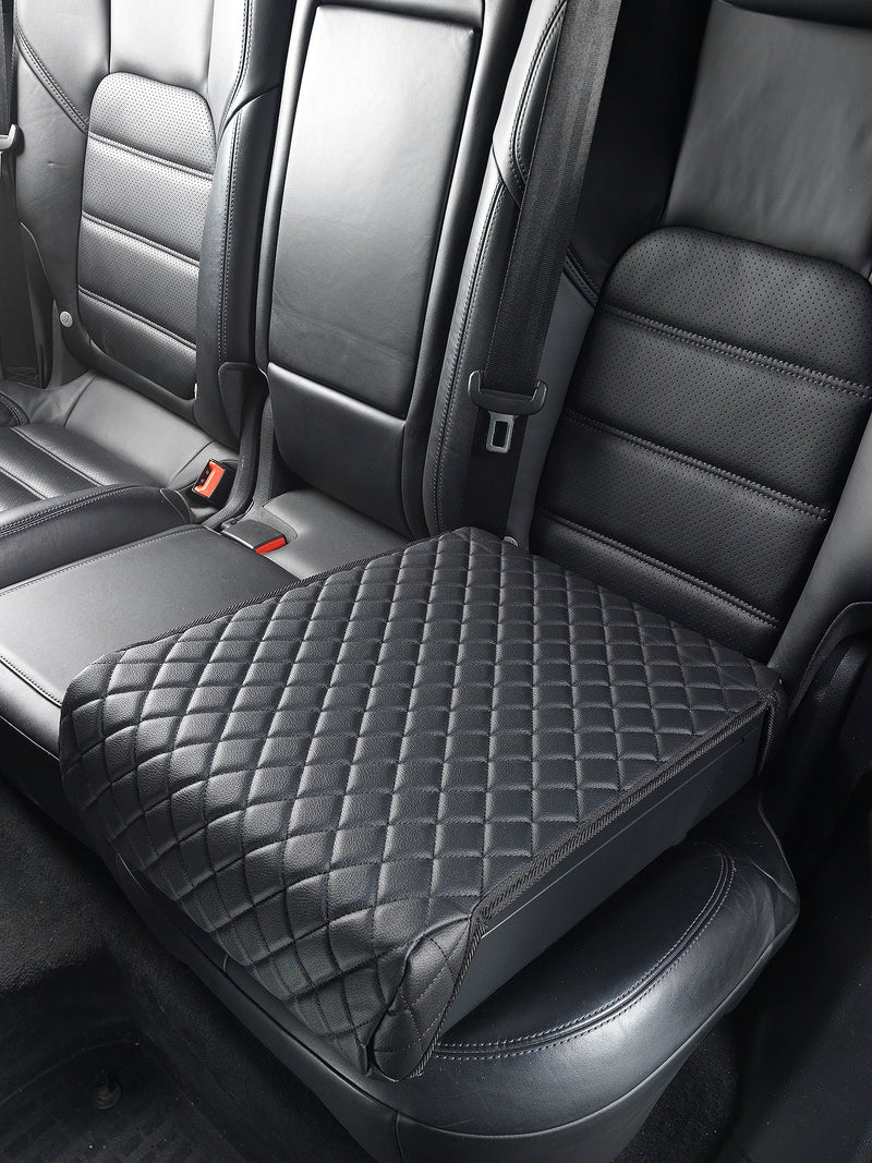 Boostedsafe shown with the included black leather cover, locked in the back of a vehicle. 