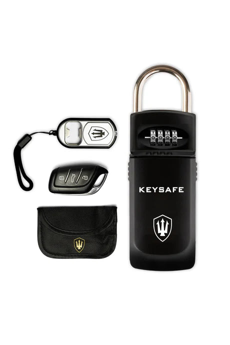 Overhead view of the Deluxe Keysafe showing the safe, and it's included components, such as RFID blocking pouch, LED light/bottle opener, and a mock Key fob