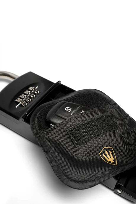 Up close view of the Keysafe deluxe box being used locking an automotive keyfob in the RFID blocking pouch.