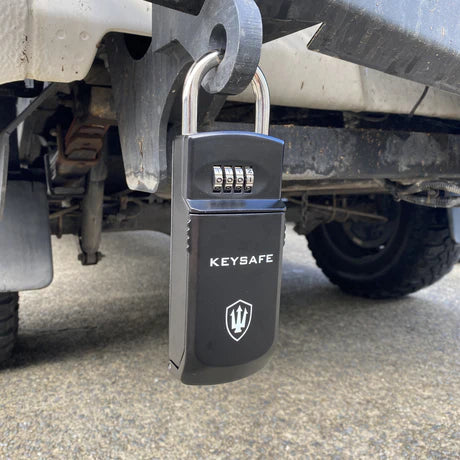 Keysafe shown safely locked to a trailer hitch on the back of a vehicle. 