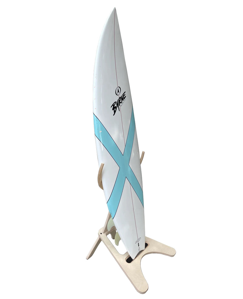 Single wooden freestanding surfboard rack shown holding a white and blue shortboard from a side angle.