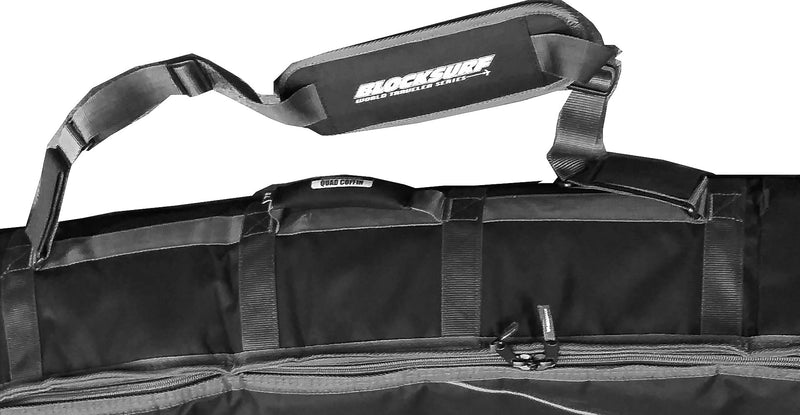 Surfboard Travel bag showing the padded arm strap, and neoprene covered handle. Black bag over a white background.