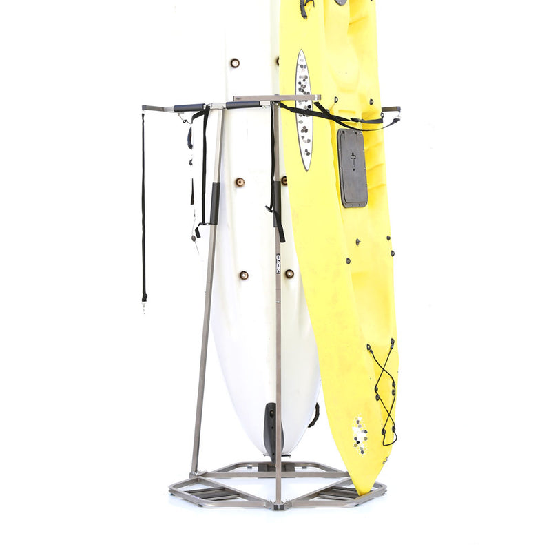 Kayak and paddleboard on a metal stand against a white background