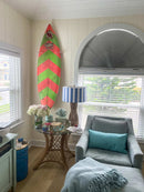 Acrylic longboard mount used to mount a "retro" G&S (Gordon & Smith) shortboard with glass-on fins. The longboard rack comes off the wall a bit to accommodate the board with fins.