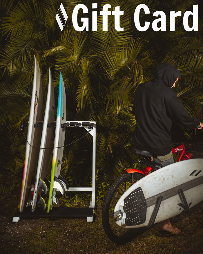 Epic Surf Racks Gift card image showing a white  surf rack holding several surfboards with a surfer next to it on a red bike.  The bike has a black surf rack holding a surfboard.  The text Gift Card is in the upper right hand corner.
