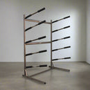 5 level metal freestanding SUP & surfboard rack sitting in a room.  The rack is dark grey. 