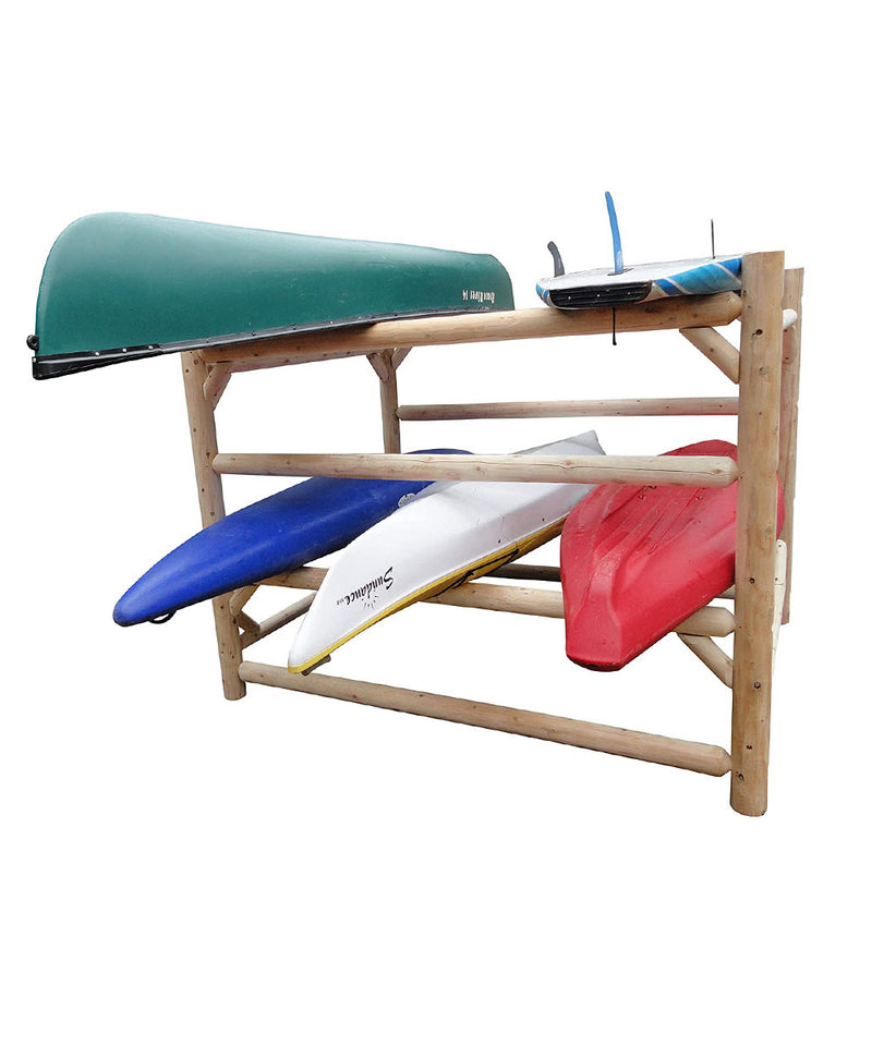 An assembled free standing 72” tall white cedar log rack with 4 rows of storage that is displaying its versatility by holding a green canoe and a blue/white soft top surfboard on the very top rack and a blue, a white, and a red kayak all in the middle row. 