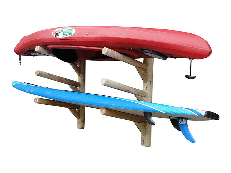 3 SUP Log Wall Rack or SUP + 1 kayak outdoor storage shown mounted to a white wall.  The wooden rack is holding a red kayak and a blue SUP stand up paddle board. 