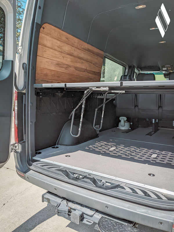  The rack shown mounted inside a Sprinter Van / Utility van.  Perfect for overloading adventures it will keep your surfboard (or SUP Stand Up Paddleboard) locked and loaded for road trips. 