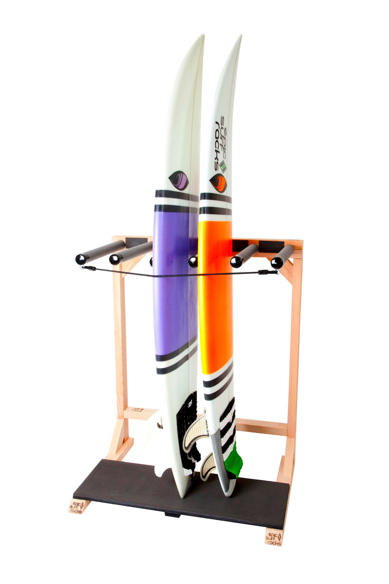 Foamy Surf Rack product shot on a white background.  The  sanded wood vertical freestanding rack is holding two high performance surfboards.  One with an orange stripe, the other with a purple stripe.