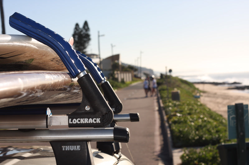 Locking Surfboard Roof Rack Locks Boards to Roof Rack