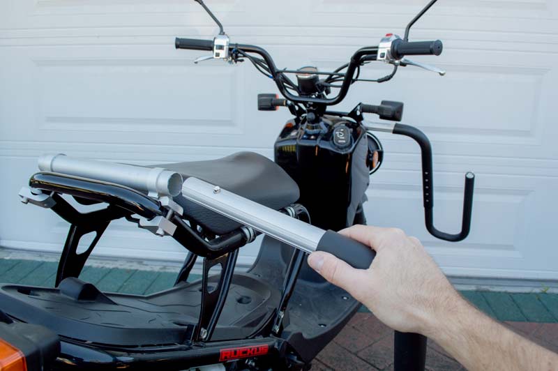 SUP Bike Rack's quick-release system shown how easy it is to take the SUP "hooks" in and out of the mount.  The image shows it's mounted on a moped, but the same system applies for the SUP Bicycle version. 