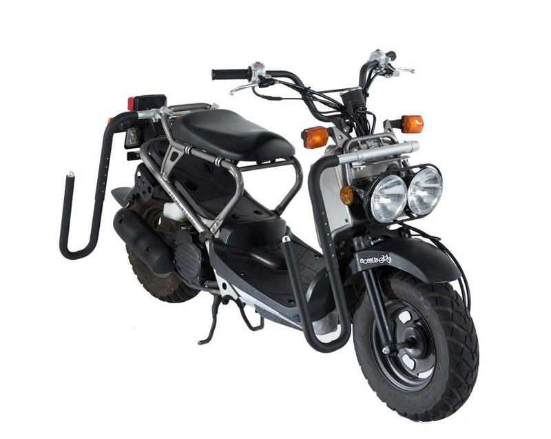 Moped Rack dual mount on honda ruckus front and rear mounts with a white background