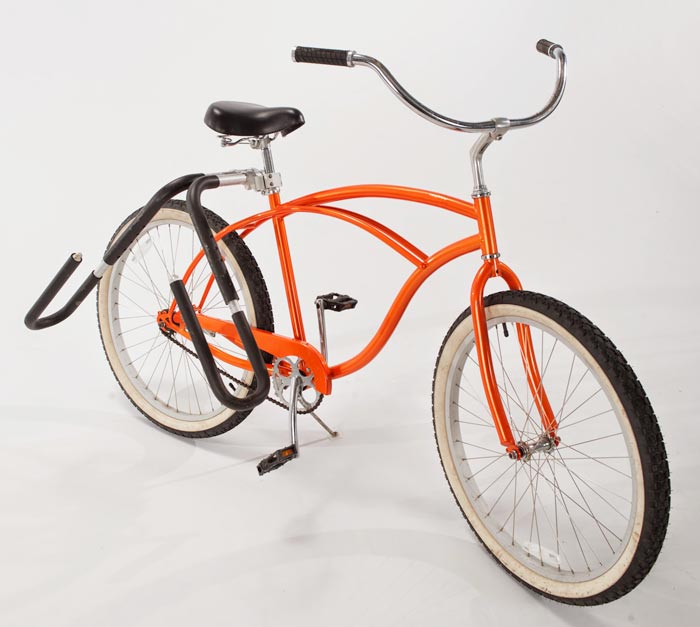 Single-Mount surfboard rack attached to an orange beach cruiser. There is no surfboard rack in the bike. The image is on a white background. 
