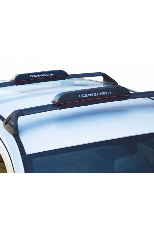 Soft Racks | Rax Pads | SUP - Shortboards - Longboards shown mounted to an aftermarket luggage rack on a white car.  