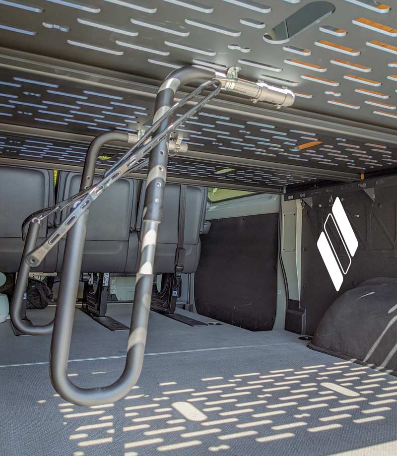 This rack being shown mounted on the underside of a platform within a sprinter / utility van.  The rack keeps the board up off the vans floor safely out of harms way.  Removing the need for a board bag. 